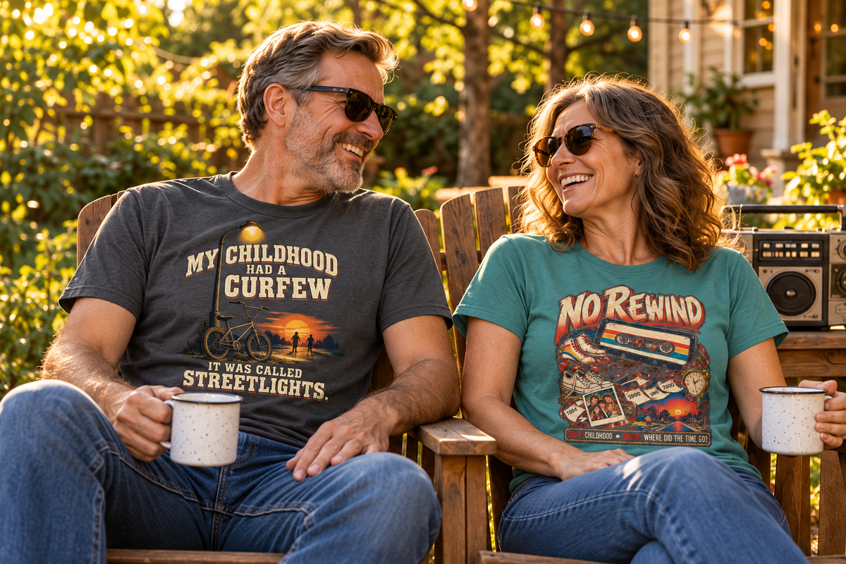 Two models wearing Childhood Curfew and No Rewind shirts in a sunlit backyard